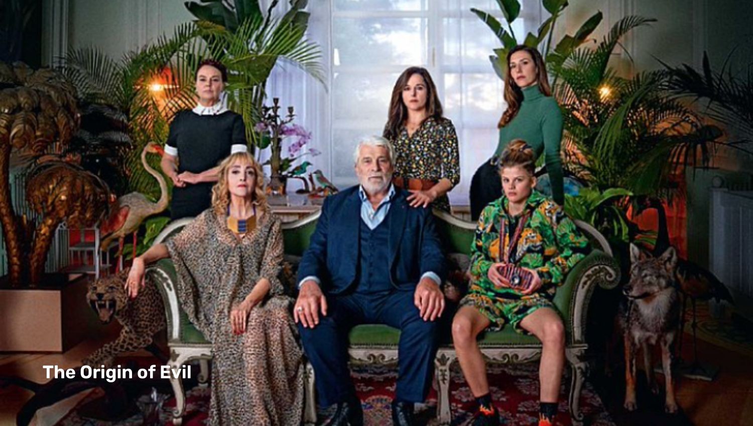 Family posing on sofa in house with plants