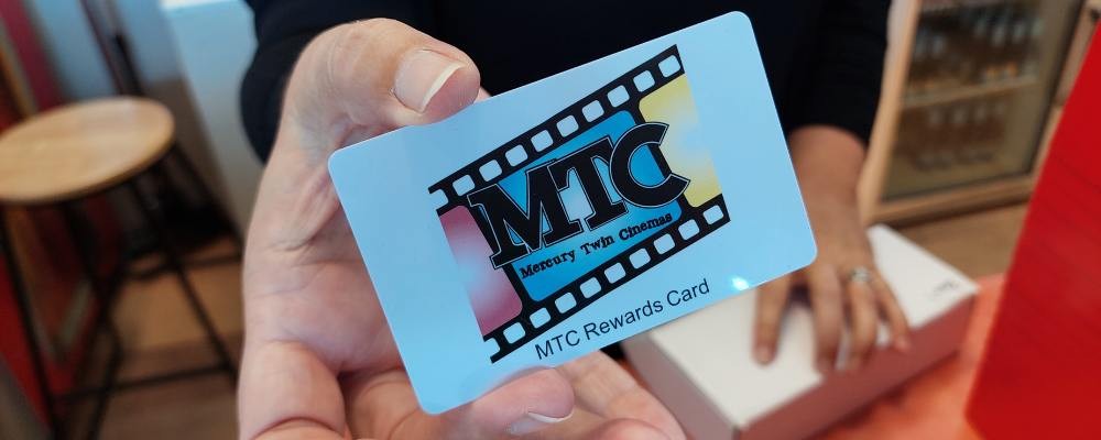 Hand holding rewards card