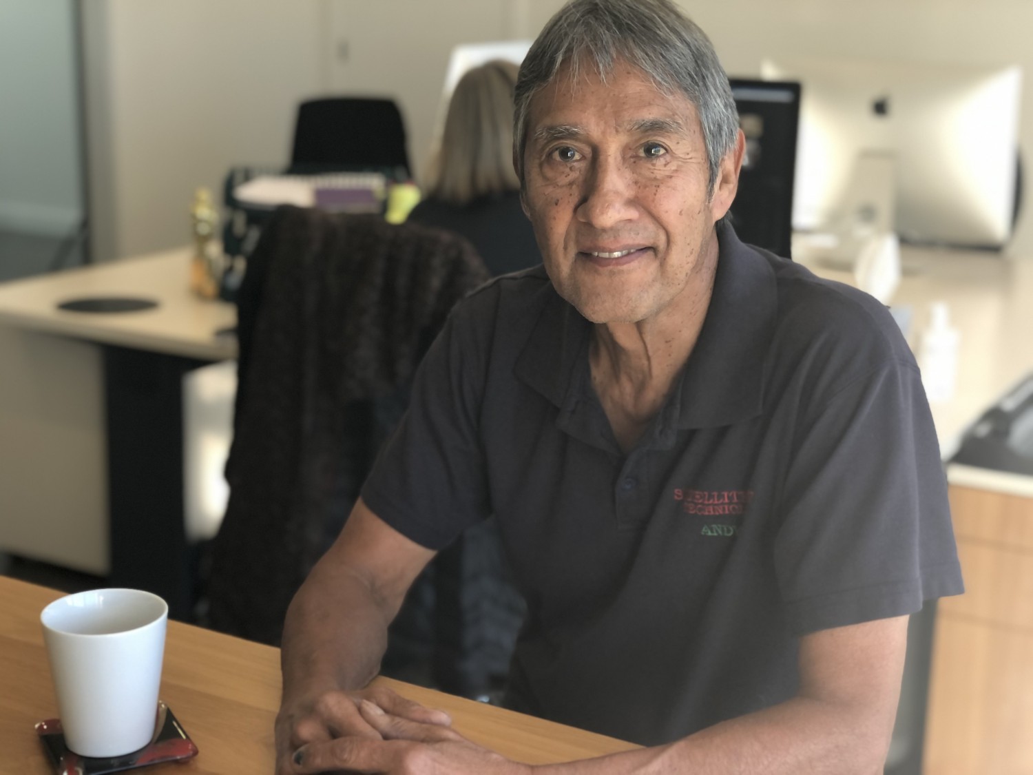 Man sitting at table with cup of tea