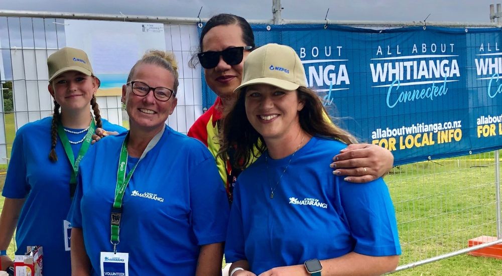 Three women in blue t shirts
