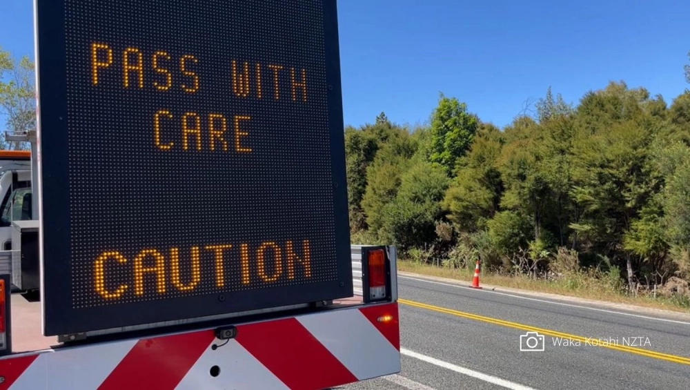 Caution road sign on road