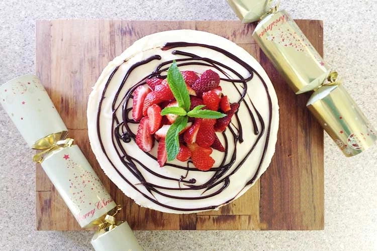 Lemon and Pomegranate Torte topped with Hershey’s Chocolate Sauce and Strawberries