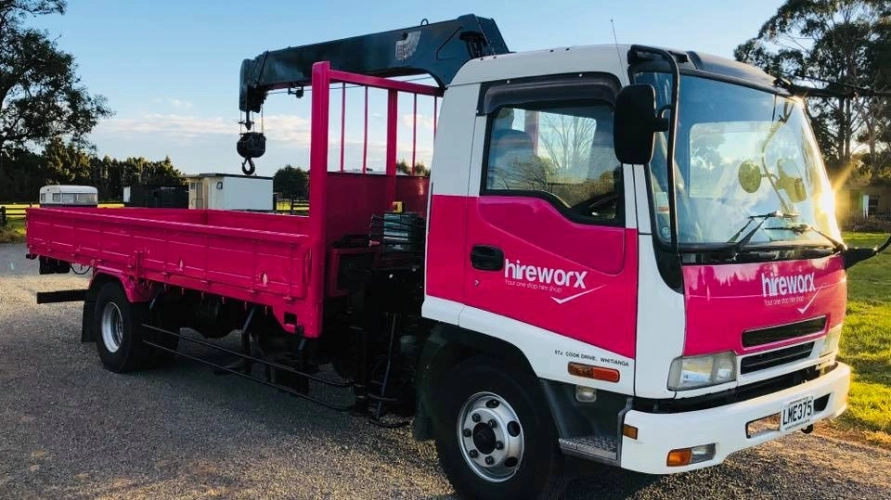 pink and white hireworx truck