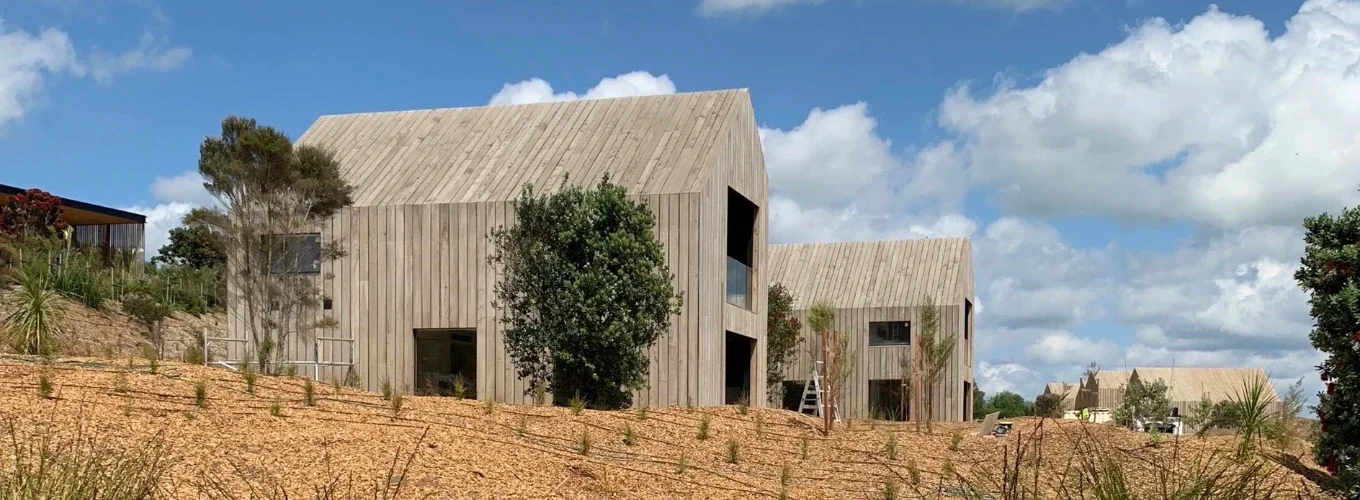 Paterson Construction two storey architectural House with clouds behind Paterson Construction two storey architectural House with clouds behind