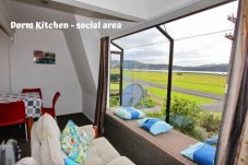 Lounge area with view to beach On the Beach Backpackers