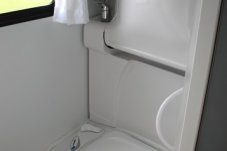 Motorhome bathroom facilities include shower, hand basin, flush toilet, and extractor fan