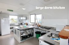 Communal kitchen area On The Beach Backpackers