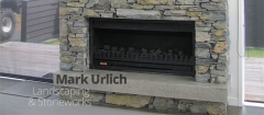 Inside stone fireplace by Mark Urlich Landscaping & Siteworks