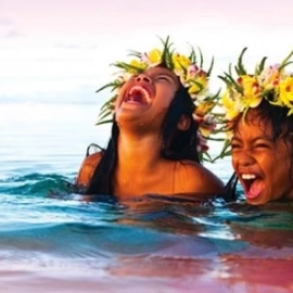 Girls with flowers in hair laughing