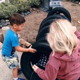 Children playing with tyres