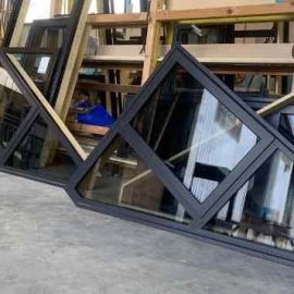 Triangle glass windows sitting on floor