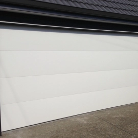 Flatline smooth color steel sectional garage door by Doors 2000 Coromandel