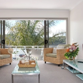 Lounge looking out at palm tree