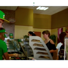 Man in green shirt and hat