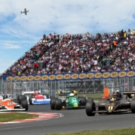 Formula one car race with crowd