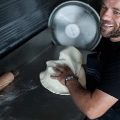 Fresh dough is rolled to make the perfect pizza base.