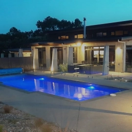 Swimming pool and house at night