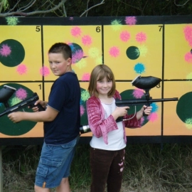 boy and girl with paintball guns