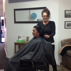 Hairdresser at work cutting hair