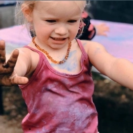 Small girl with red singlet
