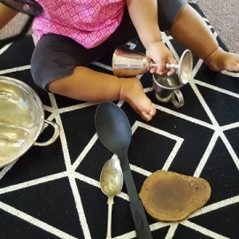 Child playing with dishes