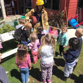 Children looking at fireman