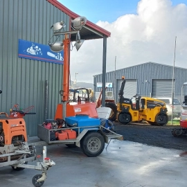 Front yard of commercial hire shop diggers and machinery