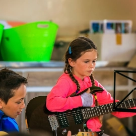 Girl and boy with guitars