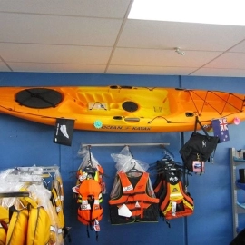 Kayak on wall and life jackets