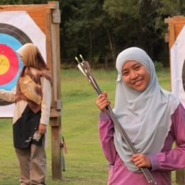 Girls with arrows and archery targets