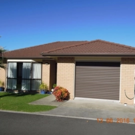 Brick house with brown tiled roof