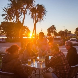 Sunsets, woodfired pizzas, and beers by the beach.