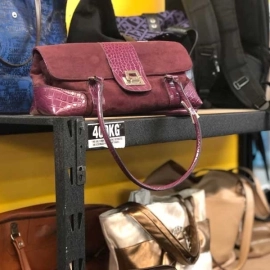 Maroon bag on shelf