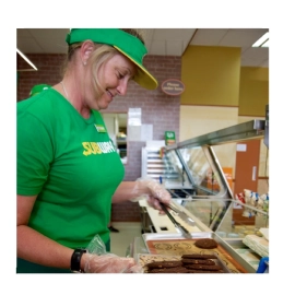 Woman in green shirt with cookies