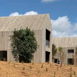 Paterson Construction two storey architectural House with clouds behind
