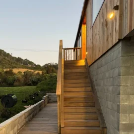 Paterson Construction wooden stairs leading up to two storey house
