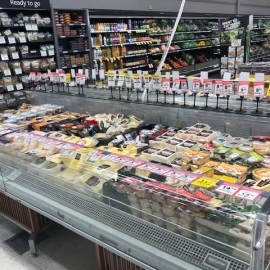 Deli display cooler with cheeses