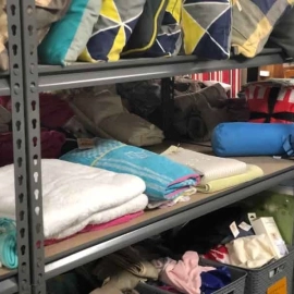Sheets and towels on shelf