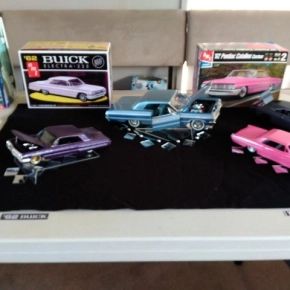 Black, blue and pink model cars
