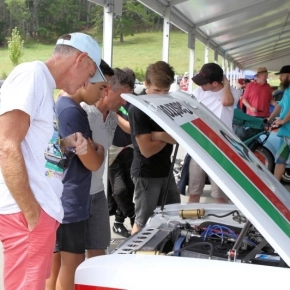 Car enthusiasts looking under the bonnet at the Leadfoot Festival Hahei