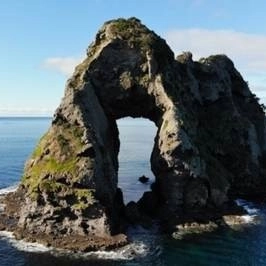 island with hole in rock.