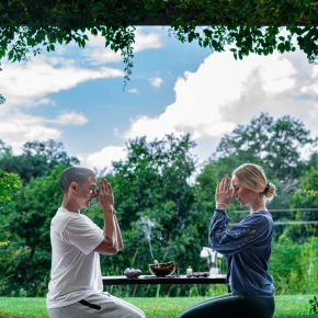 two woman in yoga poses